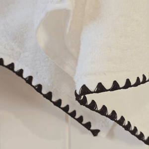 French hand towel hanging with black trim