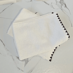 Issey French Cotton hand towels on marble surface