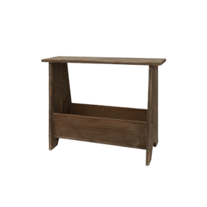 Close-up of weathered wood grain on compact stool with storage space beneath seat.