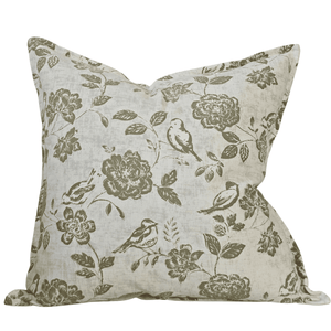 Decorative square cushion with floral and bird pattern on a white background