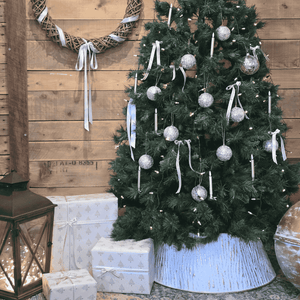 Étoile de Lune Christmas Tree Skirt in white and gold – under Christmas tree with gifts