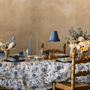 Dining table set with floral arrangements, candles, and a lamp. Versailles napkins styled with matching placemats for a coordinated French table Versailles Tablecloth