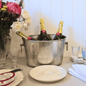 Côte des Bar Ice - Champagne Bucket with three bottles of Moet Champagne with flowers and scallop plate. Champagne Bee Glasses, linen napkins and Cyrstal Wine Glasses