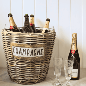 Wicker ice bucket with crytal champagne flutes
