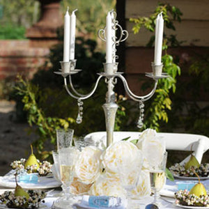 Elegant champagne flutes in use during French-inspired celebration