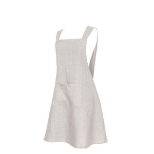 A natural color French linen Kyoto apron with a large front pocket and cross-back design.