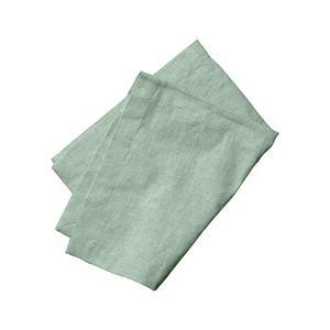 Provence Mint Linen Napkins folded on a white surface