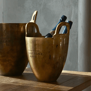 Cuvée de Prestige small champagne buckets styled beside large champagne bucket