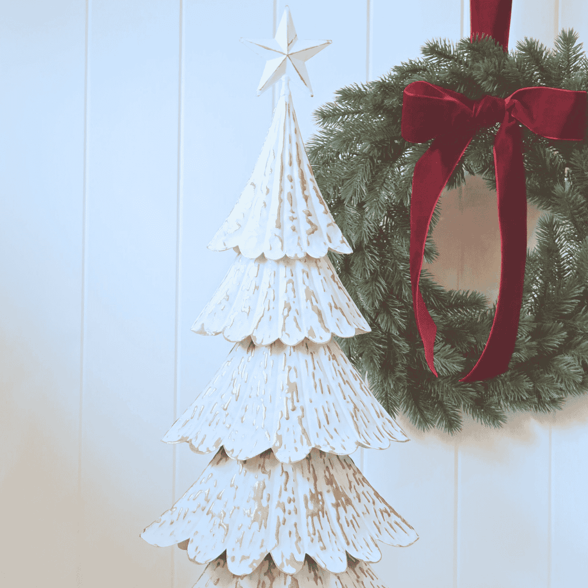 Close-up of embossed gold detailing on tiered metal Christmas tree