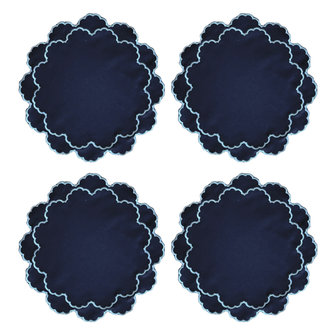 Four navy blue placemats with embroidered scalloped edges .  Malmaison - Luxe & Beau - Versailles Embroidery Heirloom Placemats - Navy