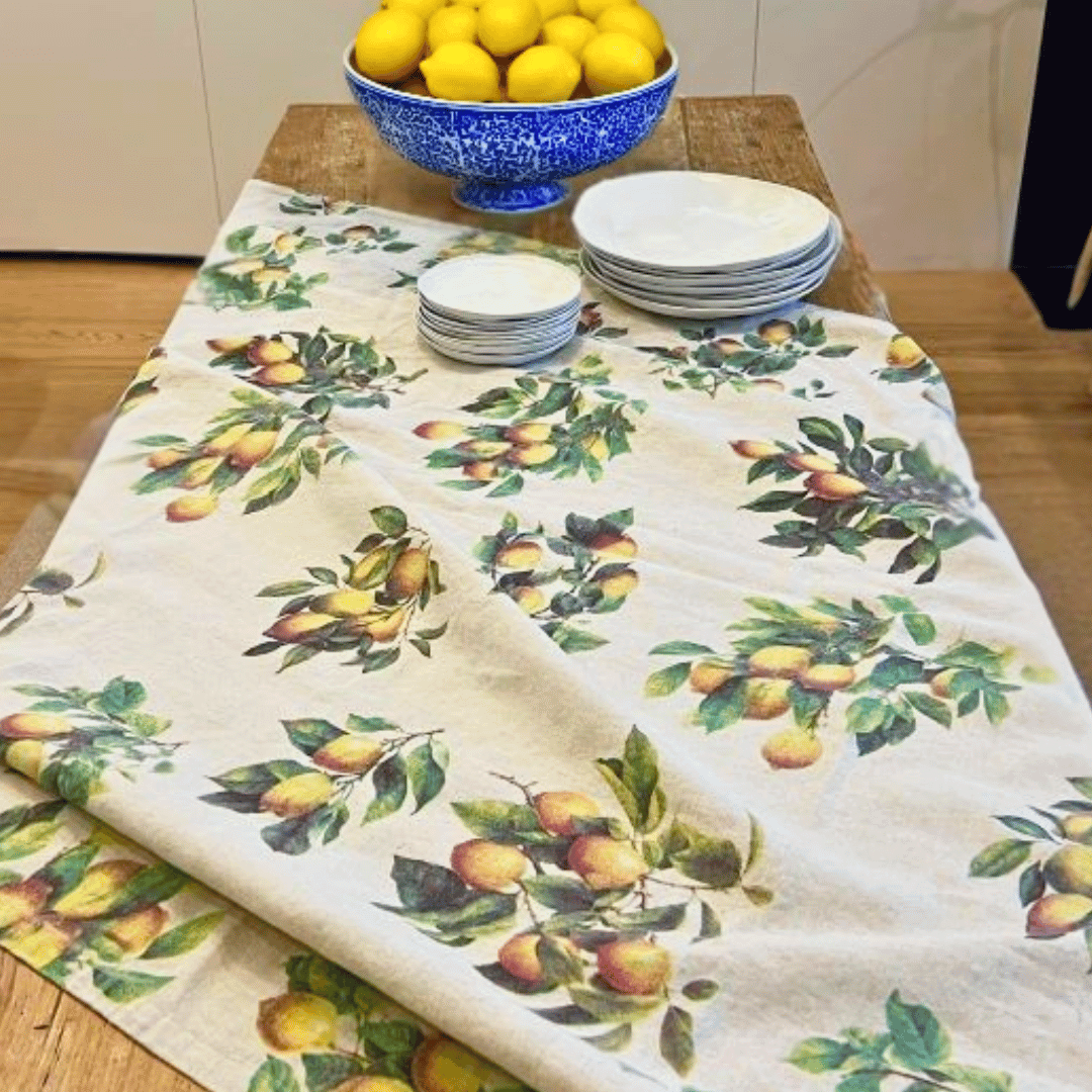 Hand screen-printed detailing of lemons on Malmaison Menton Citron tablecloth.