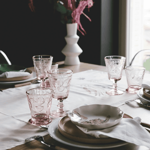 Pink French wine glasses / goblets styled on an elegant dining table