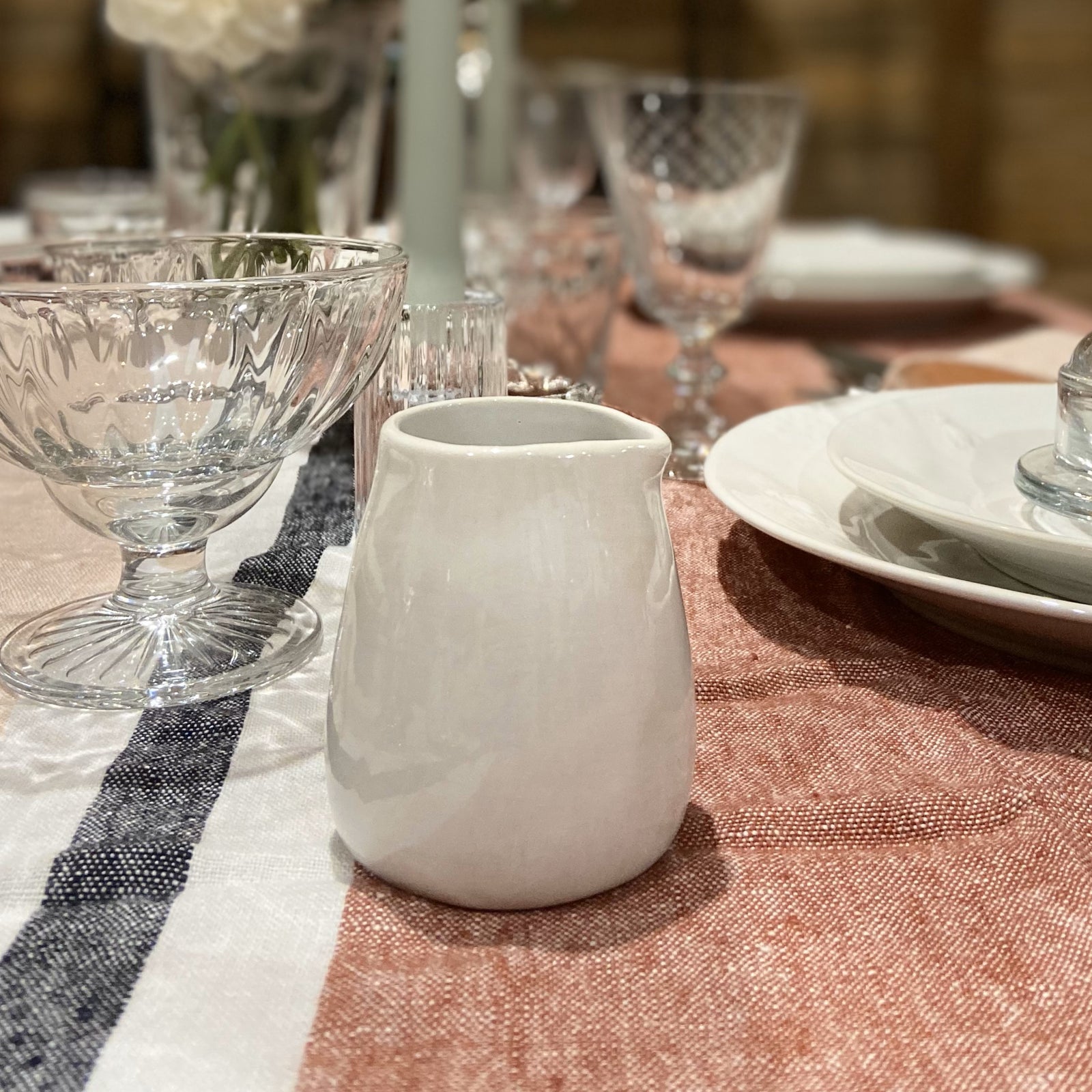Milk Jug or Creamer with Flowers in background