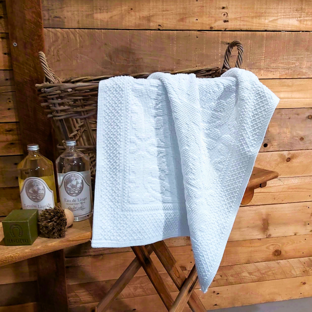 Harmony Hammam White Bath Mat on basket with Durance Laundry detergents