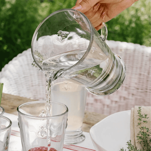 La Rochere Bee Pitcher - Water Jug pouring water into Long Bee water glasses