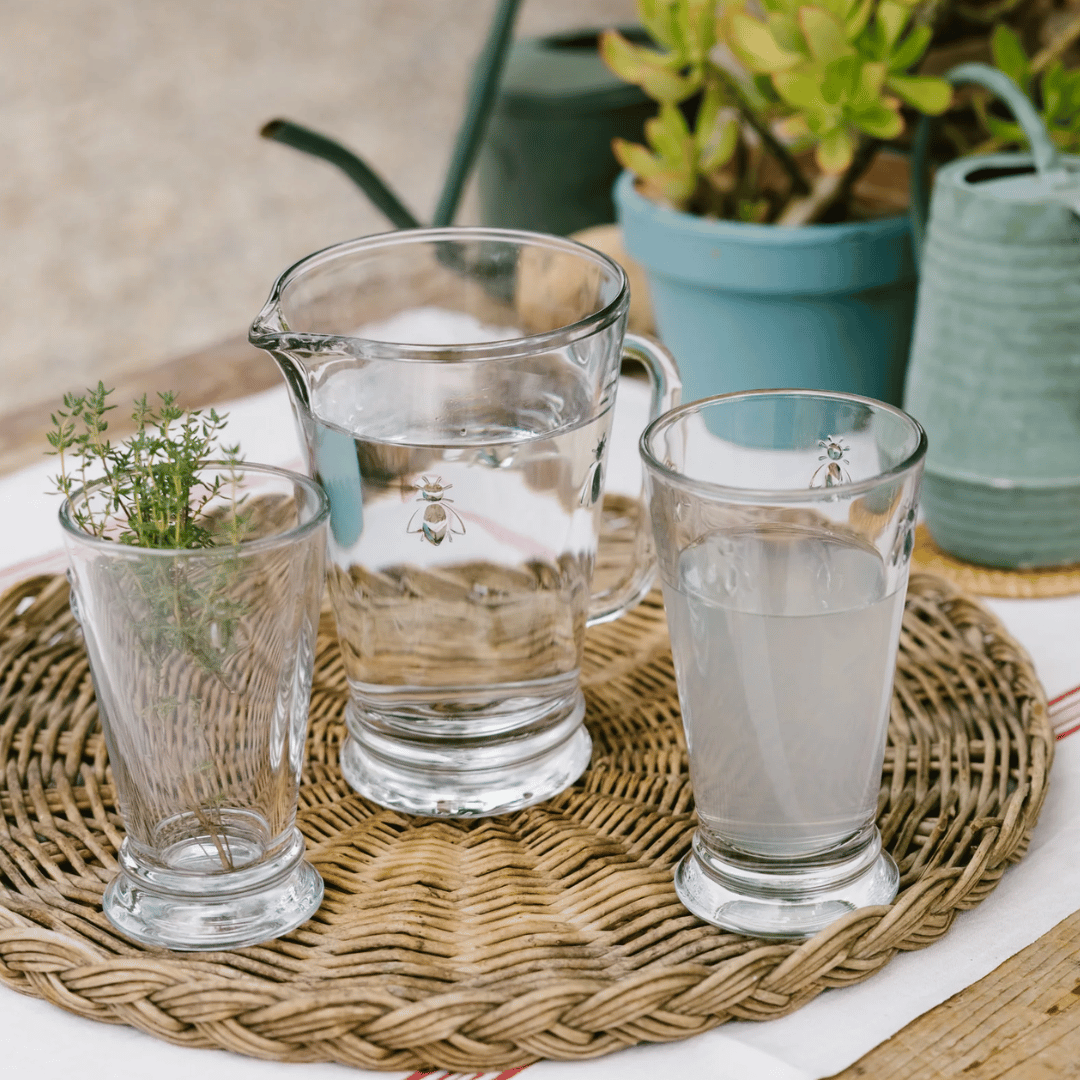 La Rochere Bee Pitcher - Water Jug with Long Bee water glasses on woven placemat