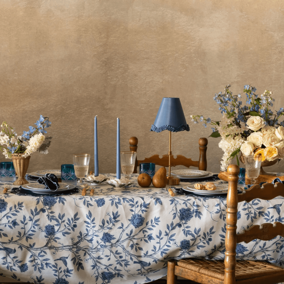 Dining table set with floral arrangements, candles, and a lamp.  Versailles napkins styled with matching placemats for a coordinated French table  Versailles Tablecloth