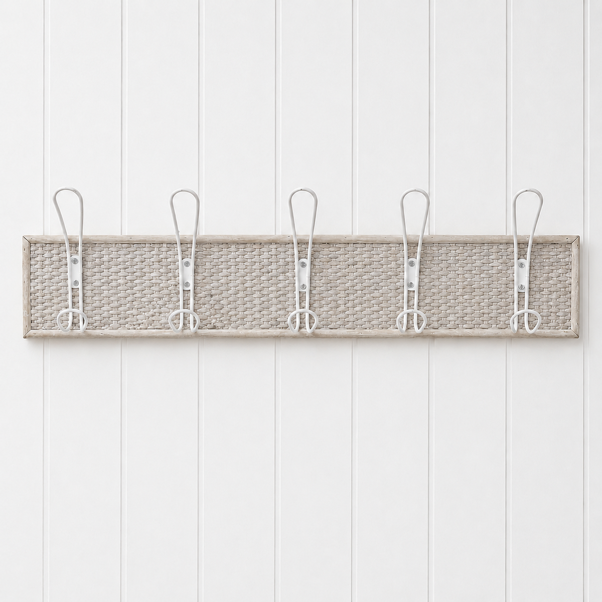 French country woven coat rack with 5 hooks on white wall