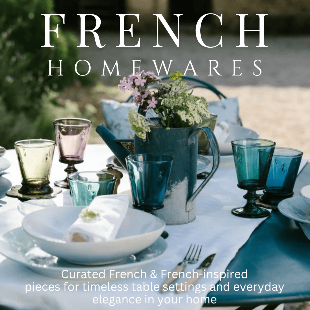 Table setting with coloured glasses on a white tablecloth, featuring 'French Homewares' text.