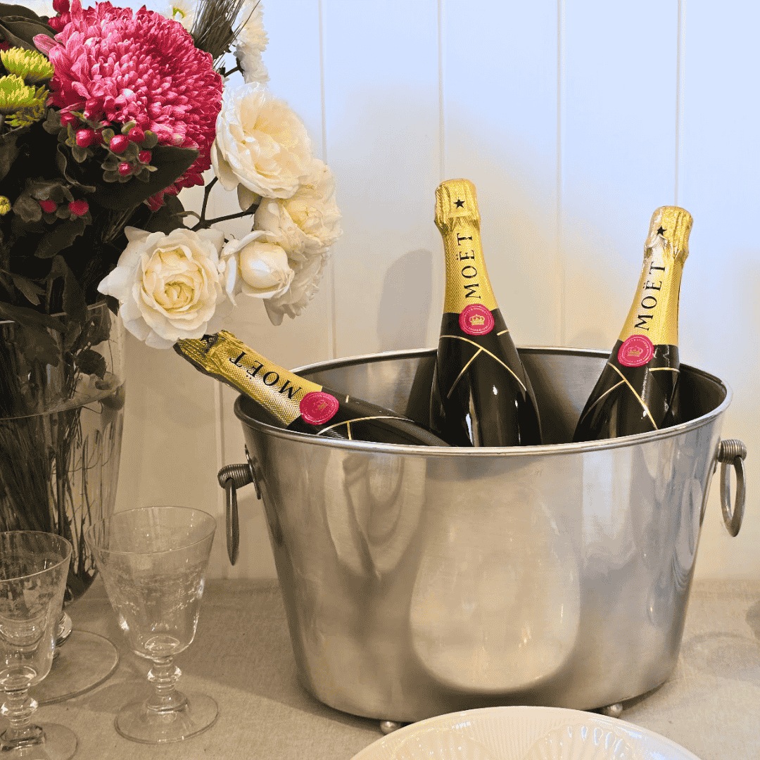 Côte des Bar Ice - Champagne Bucket with three bottles of Moet Champagne styled with flowers and Crystal wine glasses