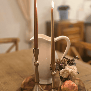 Gold taper candles 25cm styled on elegant French-inspired table