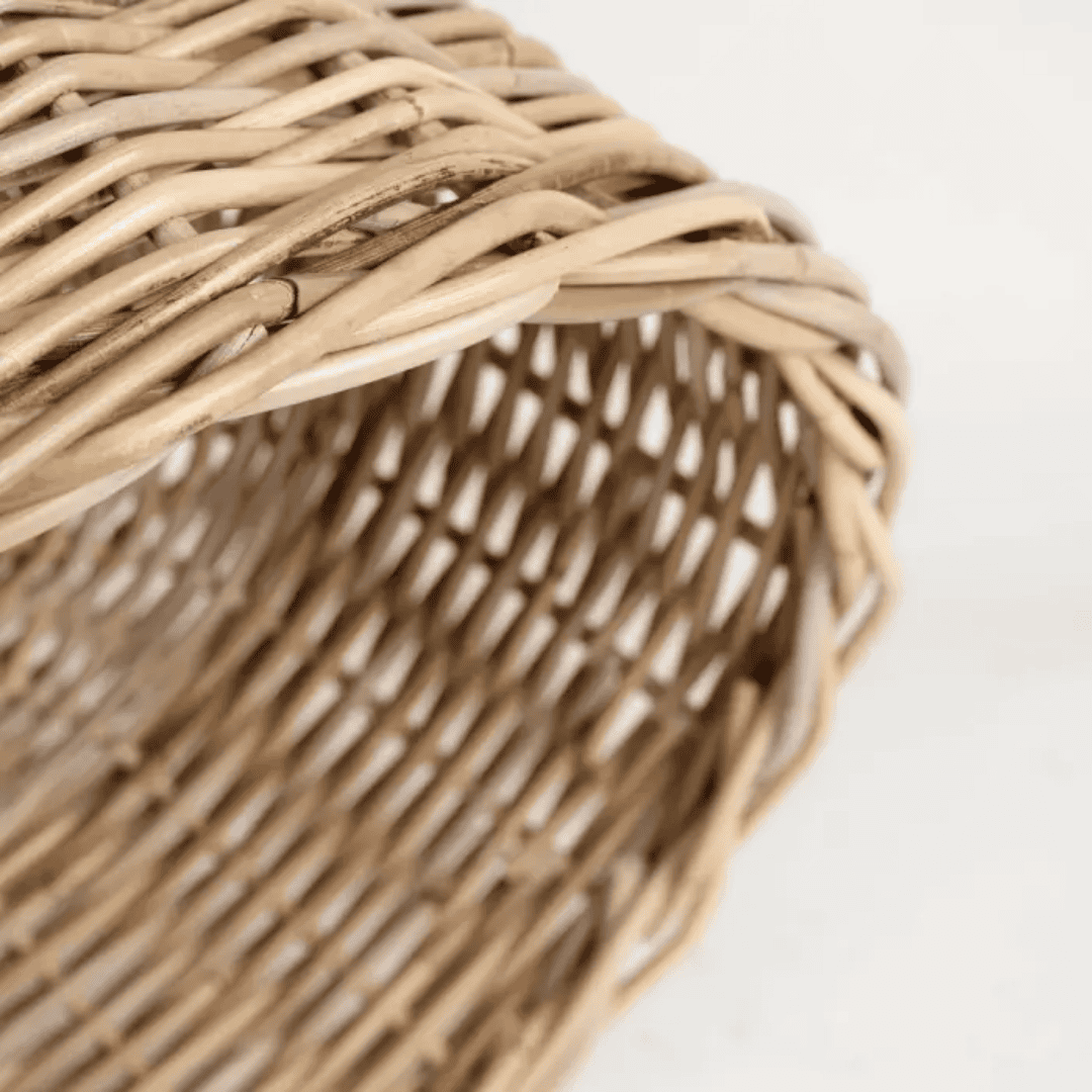 Close-up of a woven basket with a white background