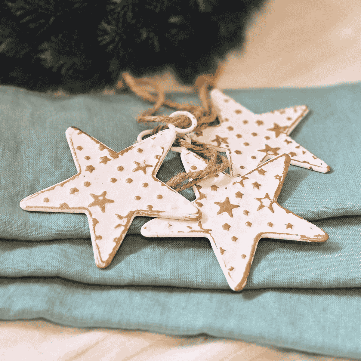 Closeup Christmas Star decoration from Étoile de Lune range – placed on Christmas Wreath