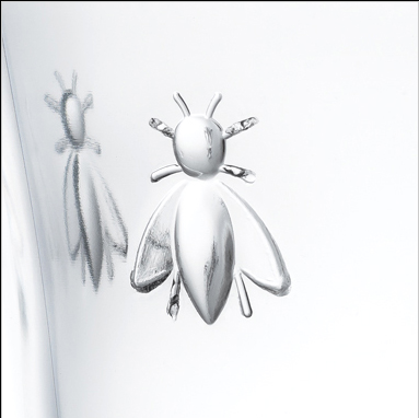 Close up image of bee emblem on wine glass goblet